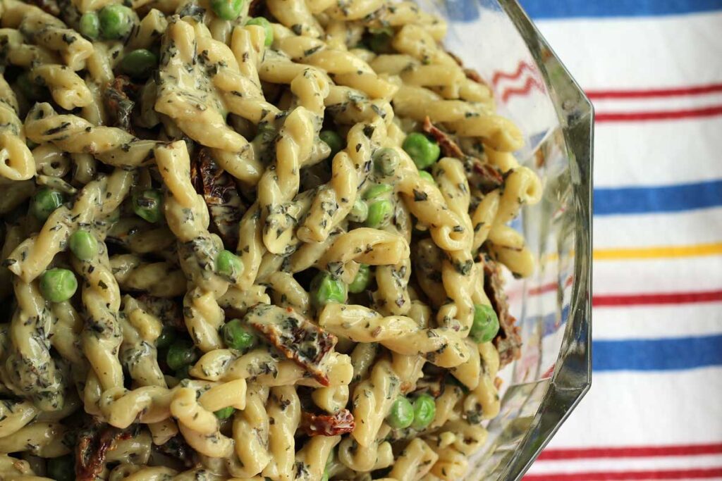Easy Creamy Pesto Pasta Salad with Peas and Sundried Tomatoes
