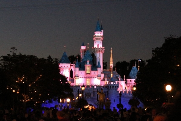 Sleeping Beauty Castle at Disneyland lit up at night