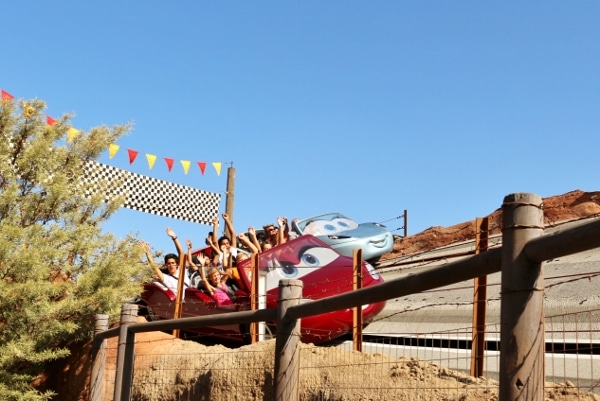 two cars racing down a track