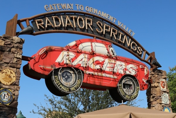 a large sign with a red car that says Radiator Springs Racers