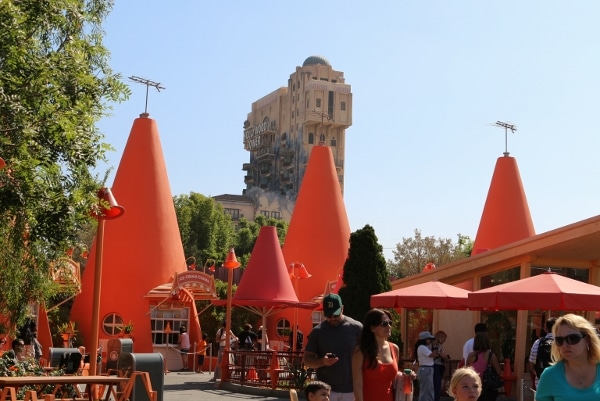 giant orange traffic cones with the Tower of Terror in the background