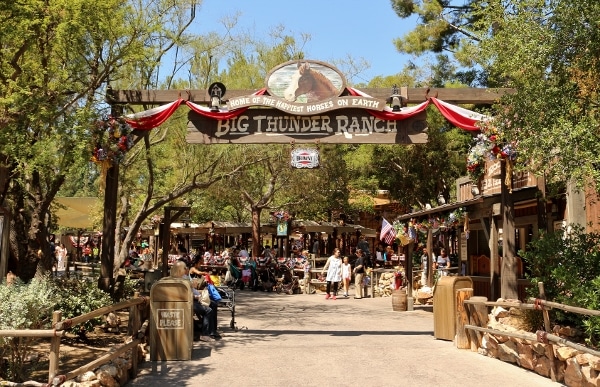 a sign that says Big Thunder Ranch over an entrance