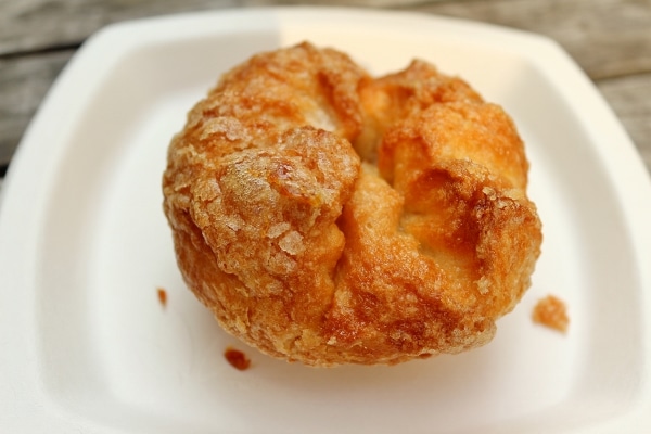 A small flaky pastry on a white plate