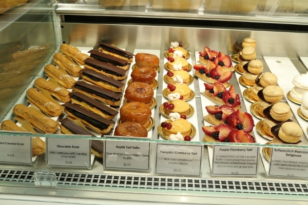 a bakery display case with a variety of desserts for sale