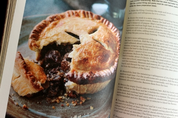a meat pie with a piece broken off