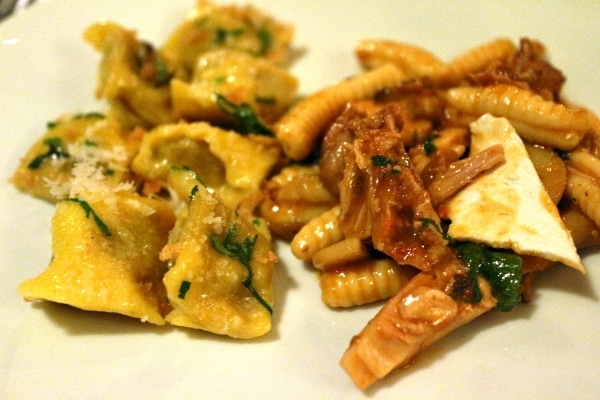 A plate of two different types of pasta side by side