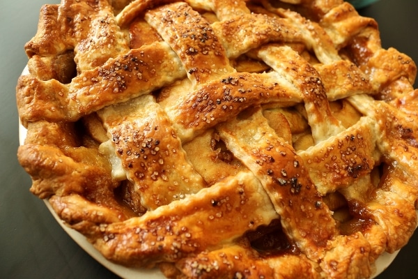 A closeup of a baked lattice topped by with a dark golden brown crust
