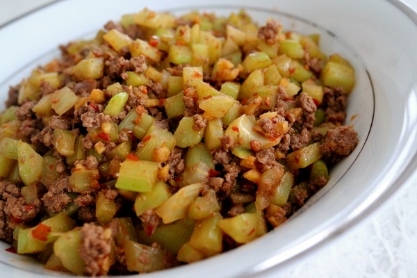 closeup of stir-fried celery and ground beef in a white bowl