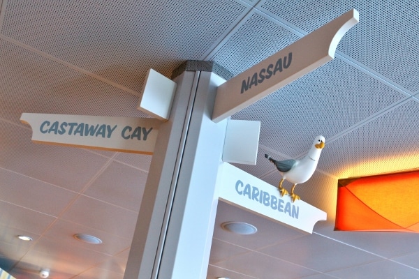 a directional sign pointing to Nassau, Caribbean, and Castaway Cay