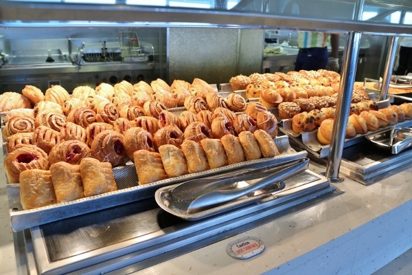 rows of breakfast pastries on a buffet