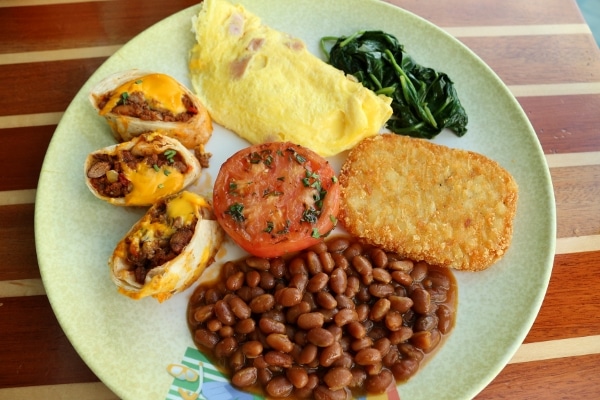 overhead view of a plate of breakfast foods from a buffet