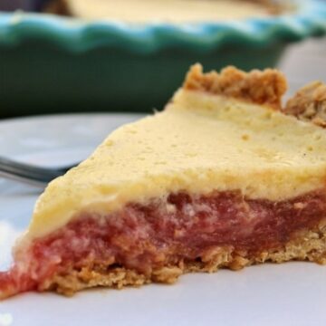 Rhubarb custard pie on a white plate