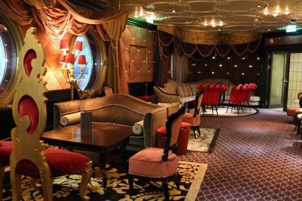 A room filled with pink and red furniture and tables