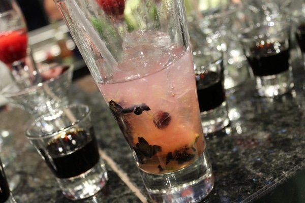 A close up of a glass half filled with a drink