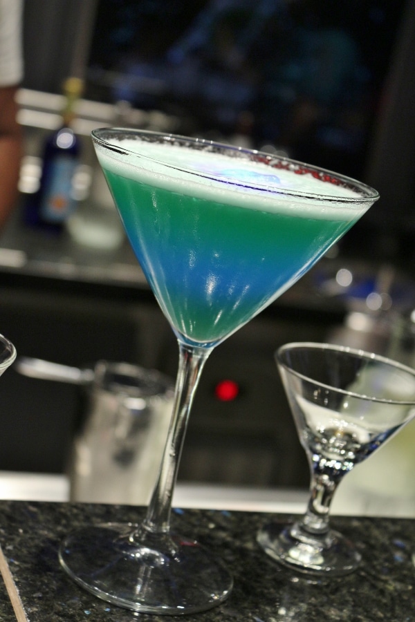 a blue and green drink in a cocktail glass