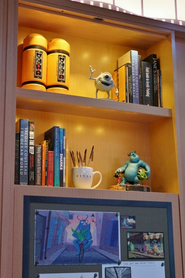 shelves of books and Monsters Inc themed decorations
