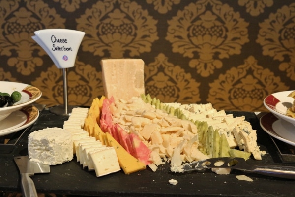 a colorful cheese display on a buffet