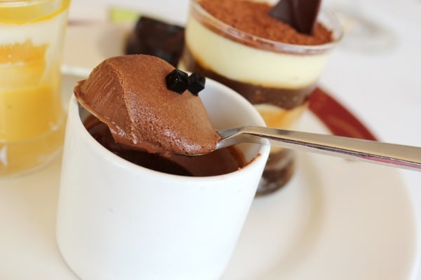 A close up of a spoonful of chocolate mousse
