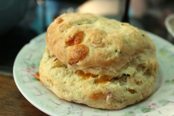 a closeup of a savory scone with cheese in it