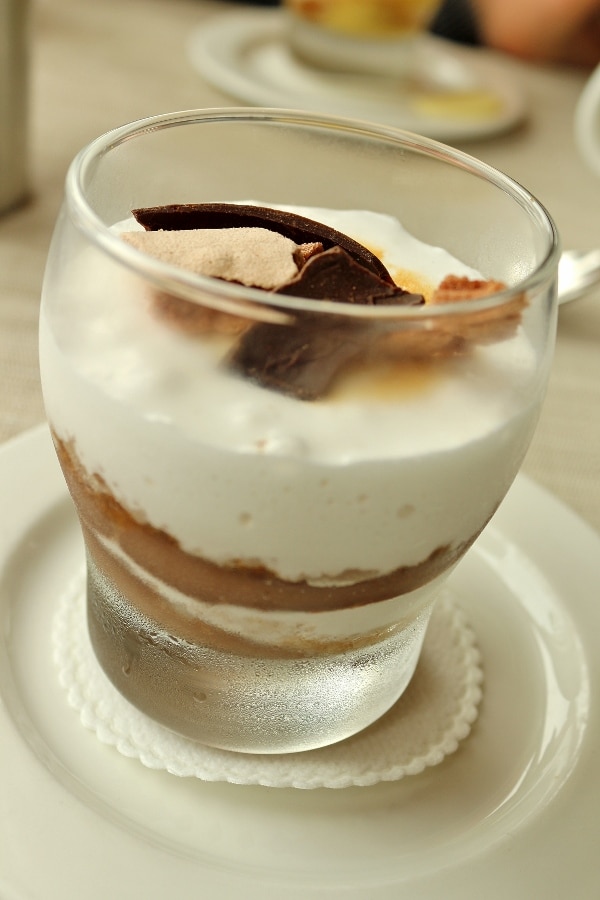 a closeup of a s\'more parfait in a glass container