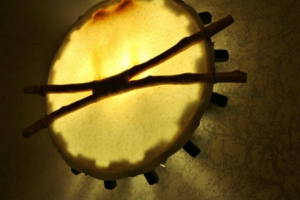 A closeup of a lighting fixture that resembles an African drum