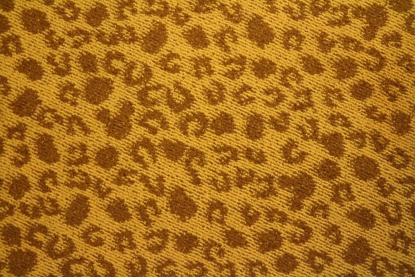 a carpet that looks like giraffe hoof prints with Hidden Mickeys