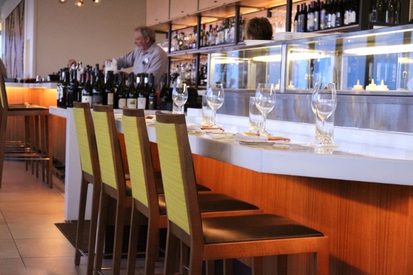 a closeup of counter seating in a fancy restaurant