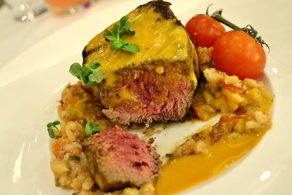 a cross section of a filet mignon steak to show the medium-rare interior