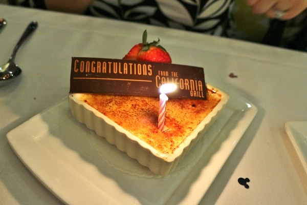 a creme brulee dessert with a sign that says Congratulations from the California Grill