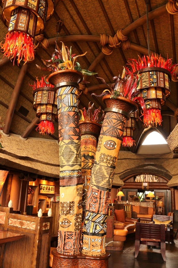 tall colorful totem looking structures inside the Animal Kingdom Villas lobby