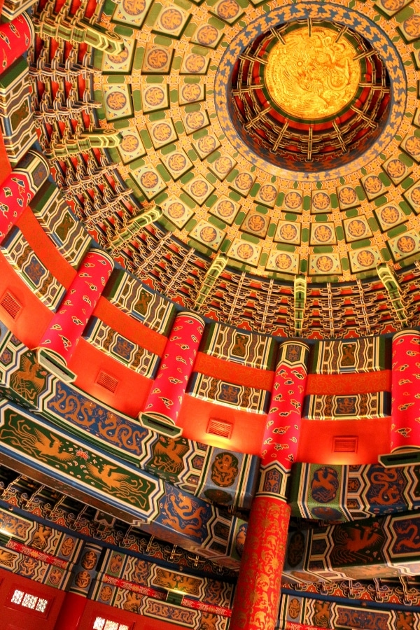 underneath a Chinese-style dome with red and gold accents