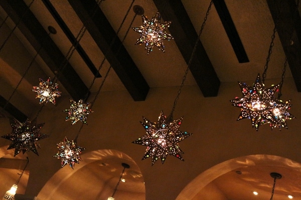 colorful star-shaped lights hanging from a ceiling