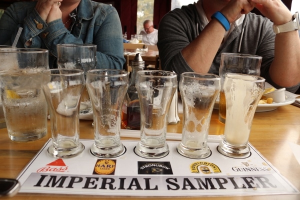 a flight of beer with all empty glasses