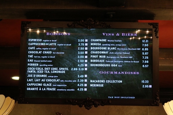 A close up of a screen with a drink menu on it