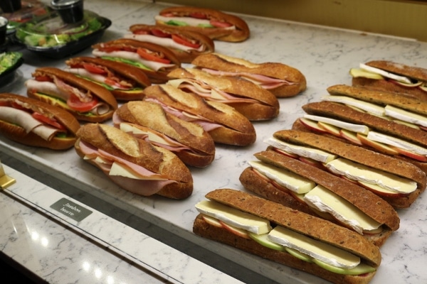 rows of French sandwiches in a display case