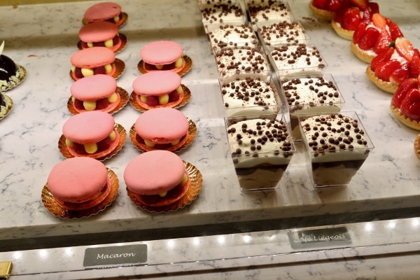 rows of desserts in a display case