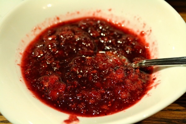 A closeup of a bowl of cranberry sauce