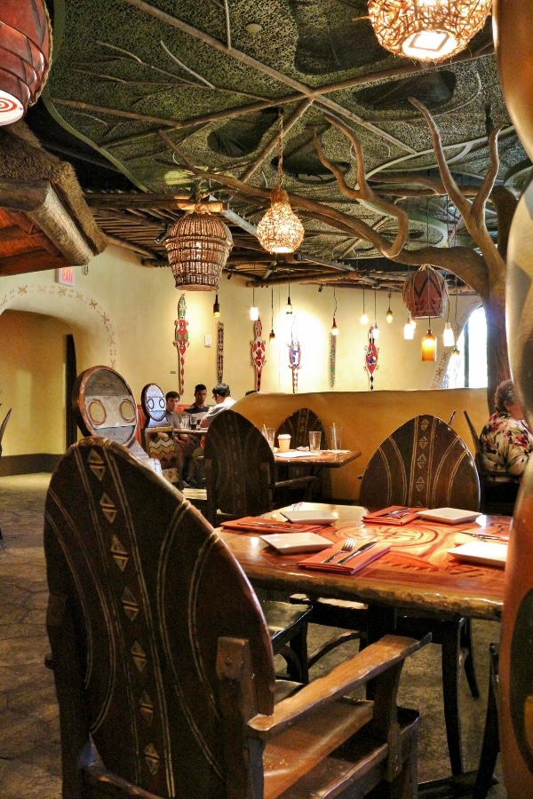 a restaurant dining room with African inspired decor
