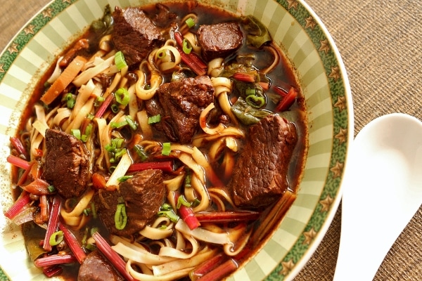 a closeup of a bowl of Taiwanese beef noodle soup