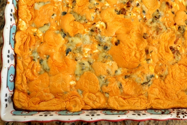 overhead closeup of buffalo chicken dip topped with blue cheese crumbles