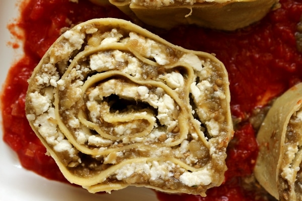 overhead view of eggplant and cheese pasta roll-ups in a baking dish