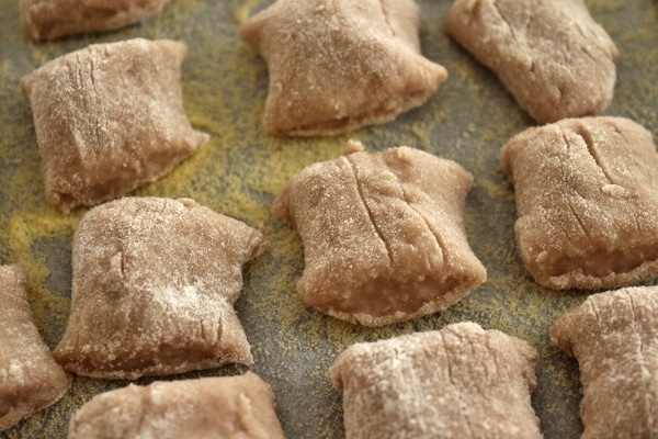 a closeup of wine infused gnocchi al Sagrantino on a tray