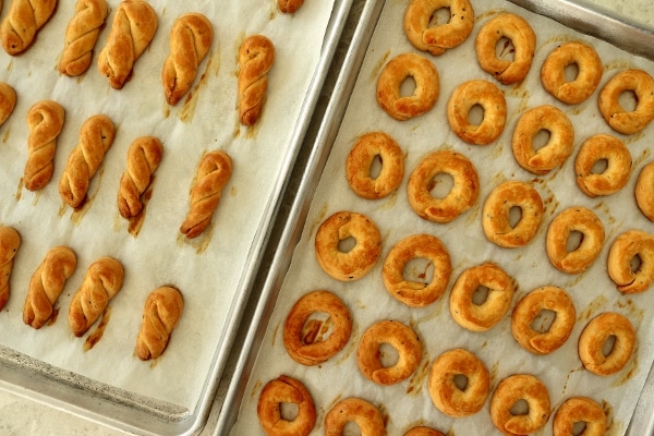 overhead view of trays of Armenian khalkha, half shaped into rings, the other into twists