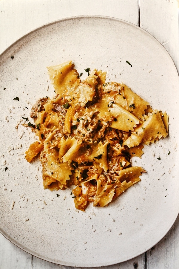 A plate of pasta with meat ragu