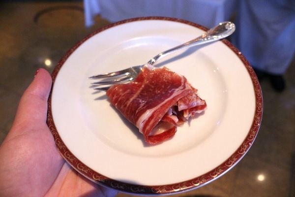 A piece of cured meat on a plate