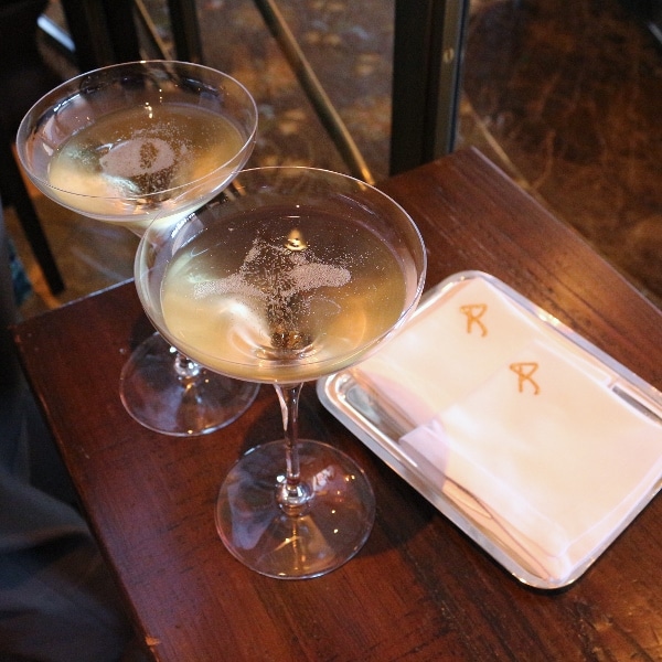 two glasses of Champagne on a wooden table