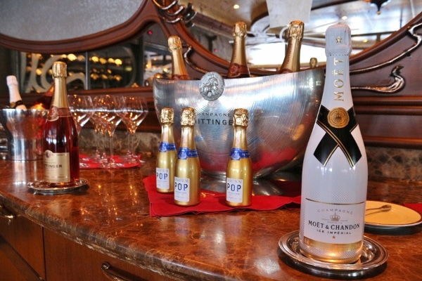 a table with various bottles of Champagne in different sizes