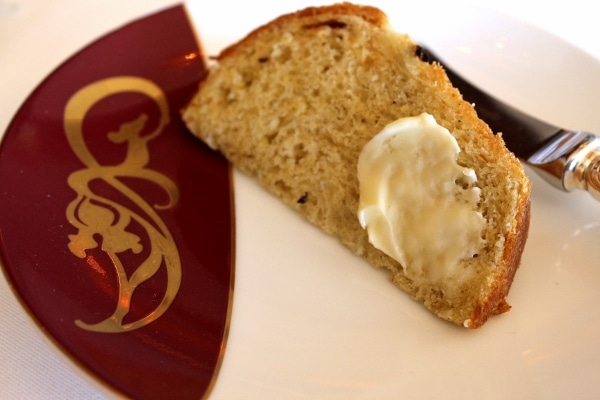 a slice of bread topped with butter on a plate