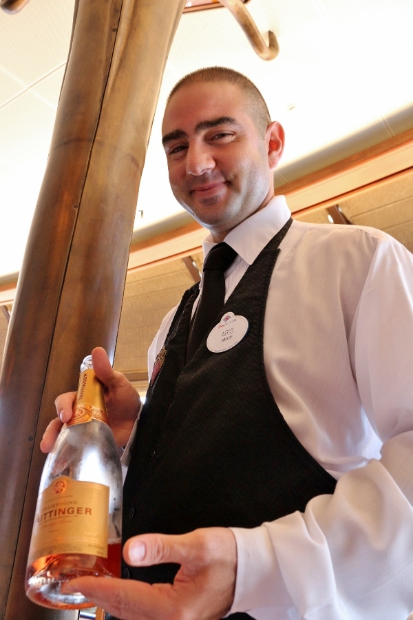 A man holding a bottle of Champagne