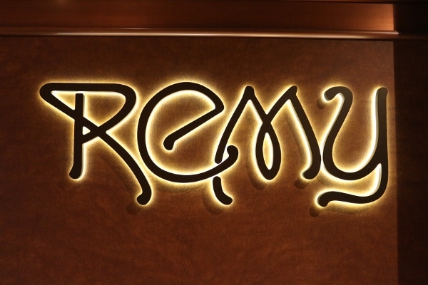 a lit up sign that says Remy